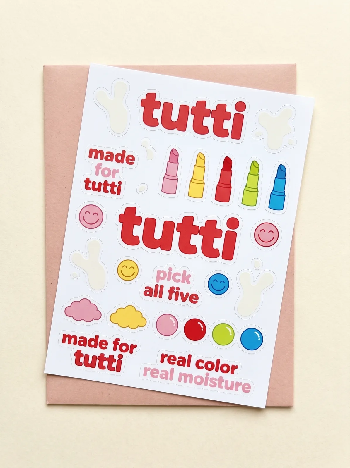 tutti welcome sticker sheet with bubbly red wordmark, smileys, milk-splash blobs, gumballs and brand affirmations